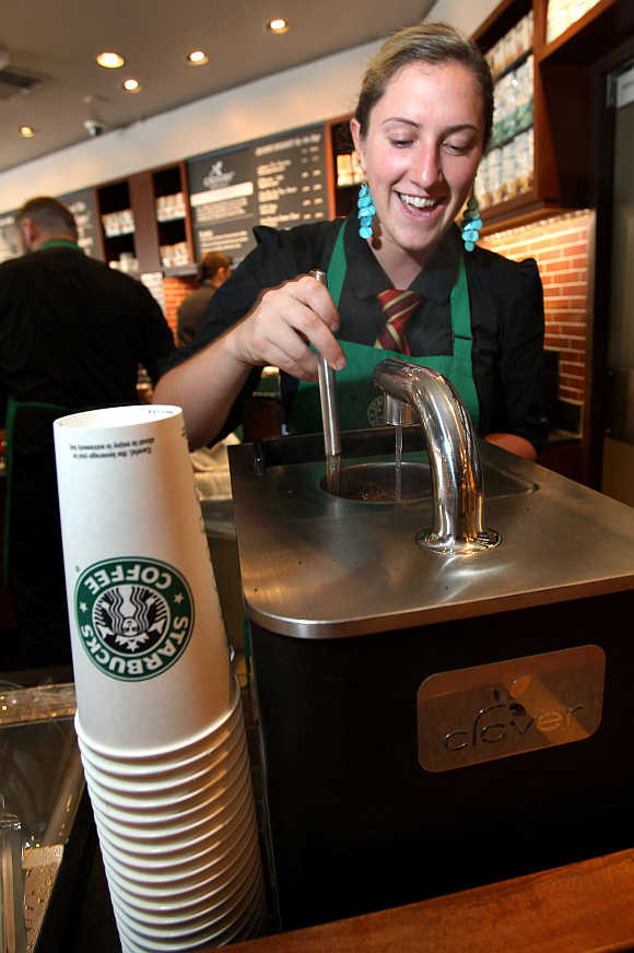 Starbucks barista Amy Hekinson makes a cup of Via instant coffee at the Queen Anne Hill Starbucks store in Seattle, Washington.