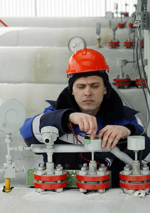 A Gazprom technician works at the gas export company's Sudzha compressor station in Russia.