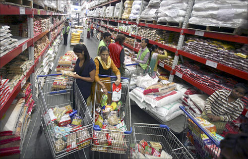 Customers shop inside a Best Price Modern Wholesale store, a joint venture of Walmart Stores Inc and Bharti Enterprises, at Zirakpur, Punjab.