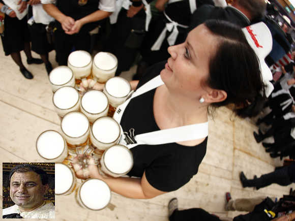 Karan Billimoria, inset. A waitress serves beers during the opening ceremony of the Oktoberfest in Munich.