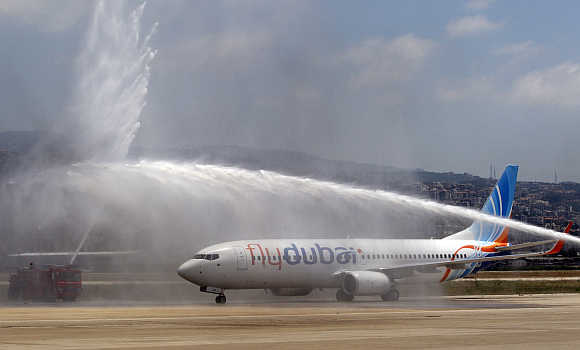Flydubai is sprayed with water at Beirut international airport.