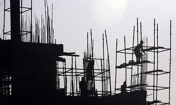 Labourers work at construction site in Chandigarh.