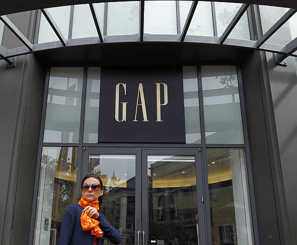 A woman walks past the Gap flagship store in San Francisco.