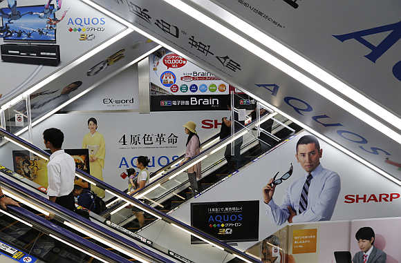 Advertisements for Sharp are seen at an electronics shop in Tokyo.