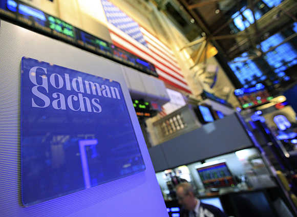 A Goldman Sachs sign is seen on at the company's post on the floor of the New York Stock Exchange.