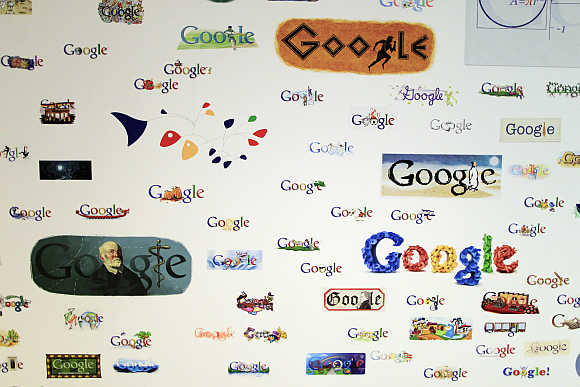 Google homepage logos are seen on a wall at the campus near Venice Beach in Los Angeles.