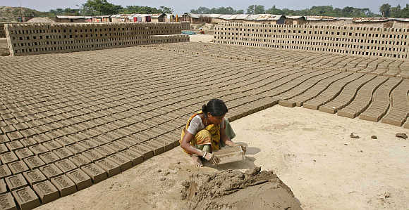 There are huge gender disparities in asset and wealth ownership, says Swaminathan. A woman working at a brickyard in Siliguri, West Bengal.