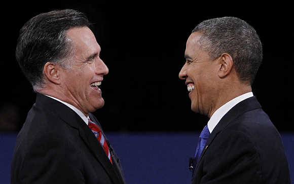 Republican presidential nominee Mitt Romney and US President Barack Obama shake hands at the conclusion of the final US presidential debate in Boca Raton, Florida.