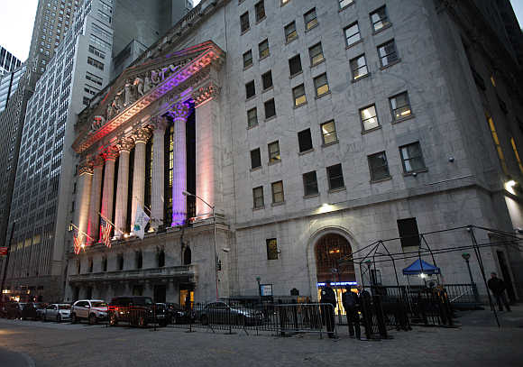 Traders and staff report to work at the New York Stock Exchange.