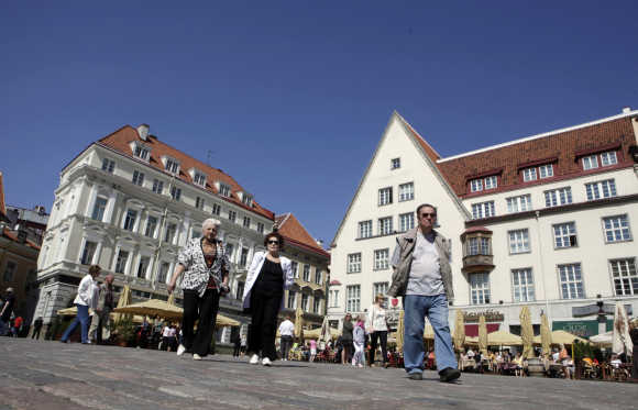 Tourists gather at the City Hall square in Tallinn.