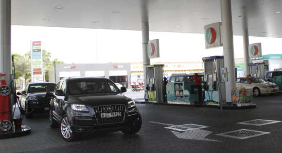 Cars queue for petrol at a station in Dubai.