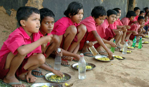 Students eat their free meal in Lambuchara village, about 35km from Agartala, Tripura.