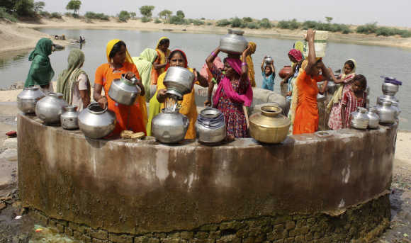 Women gather at a well to draw water at Kayla village, 65km west of Ahmedabad.