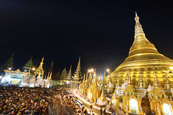 People visit the Shwedagon Pagoda during the yellow robe weaving festival in Yangon, Myanmar.
