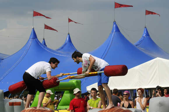 Revellers jostle during a game at the Pohoda music festival at Trencin airport, 130km north of Bratislava, Slovakia.