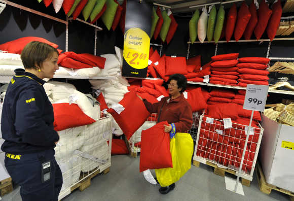 An Ikea employee helps a shopper at the Wembley branch in west London.