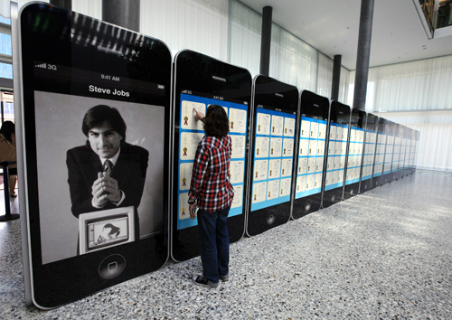 A visitor looks at Apple patents displayed at the World Intellectual Property Organization (WIPO) headquarters in Geneva.