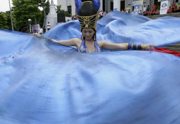 A dancer performs during the Kalesa Festival in Manila.