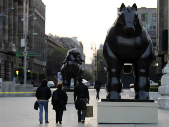 Colombian painter and sculptor Fernando Botero's bronze monumental 'Horse' sculpture outside Mexico City's Palace of Fine Arts.