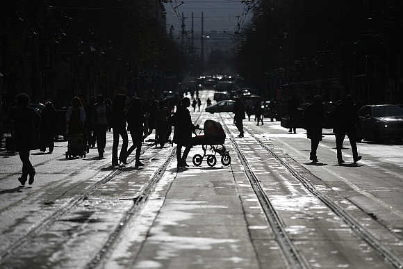 People walk on a street in downtown Sofia, Bulgaria.