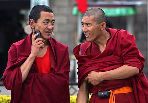 ibetan monks use their mobile phones in Lhasa, Tibet.