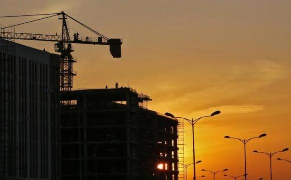 Labourers work at the construction site of hotels next to the Indira Gandhi International Airport in New Delh.