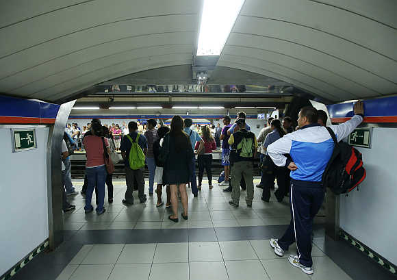Passengers wait for Metro train in Madrid, Spain.