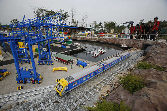 A lego train passes through a model of Malaysia's Tanjung Pelepas shipyard in the southern state of Johor.