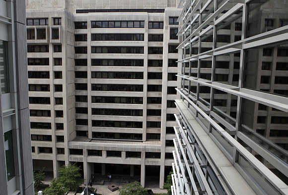 International Monetary Fund headquarters building is seen through a World Bank window in Washington, DC.