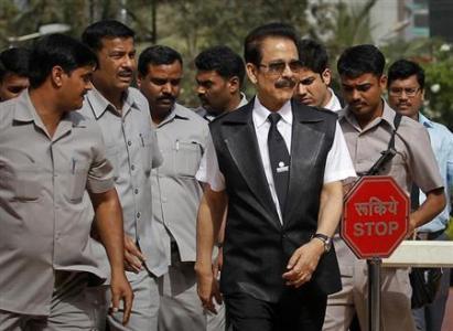 Sahara Group Chairman Subrata Roy accompanied by his security leaves the Securities and Exchange Board of India headquarters in Mumbai.