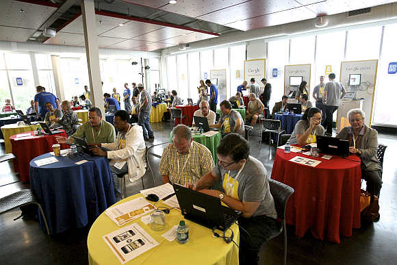 Google employees help local business owners create a mobile version of their websites at a temporary Google store in Mobile, Alabama, United States.