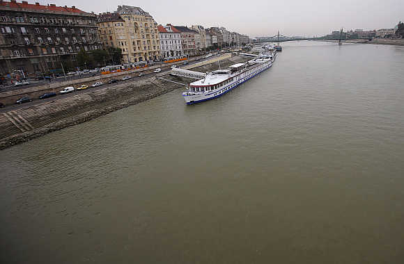 Cruise ships are floating on the Danube river in central Budapest in Hungary.