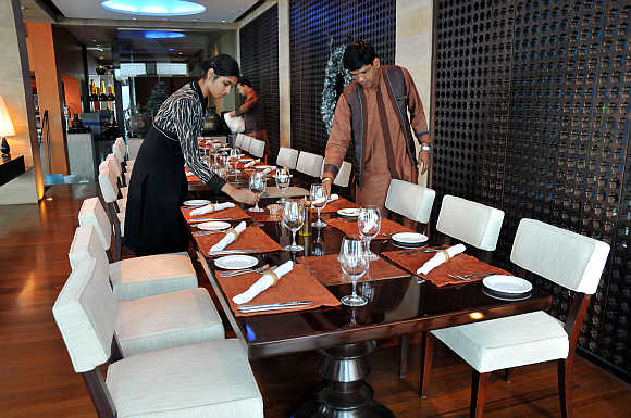 Employees of Taj Mahal hotel prepare 'Souk' restaurant in Mumbai.