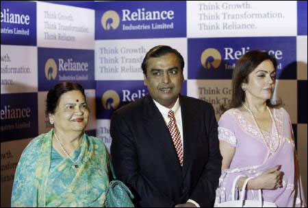 Mukesh Ambani, chairman of Reliance Industries with his wife Nita Ambani (R) and mother Kokilaben Ambani (L).