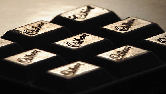 Cadburys logo on a bar of chocolate.