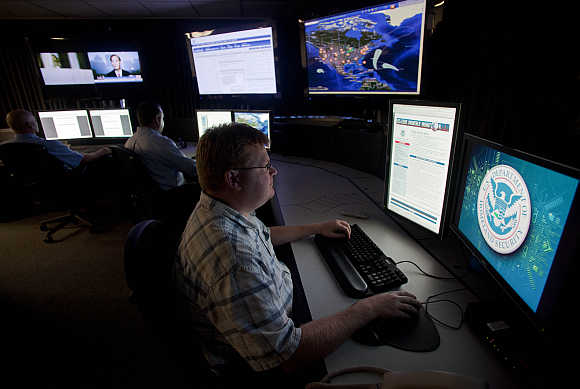 Analysts work in a watch and warning center of a cyber security defense lab at the Idaho National Laboratory in Idaho Falls, Idaho, United States.