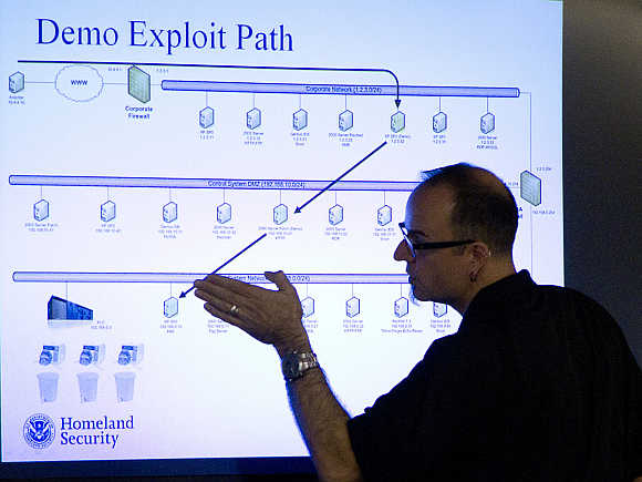 Mark Fabro, a training consultant working with the U.S. Department of Homeland Security, explains how systems can be exploited at a cyber security defense lab at the Idaho National Laboratory in Idaho Falls, Idaho, United States.