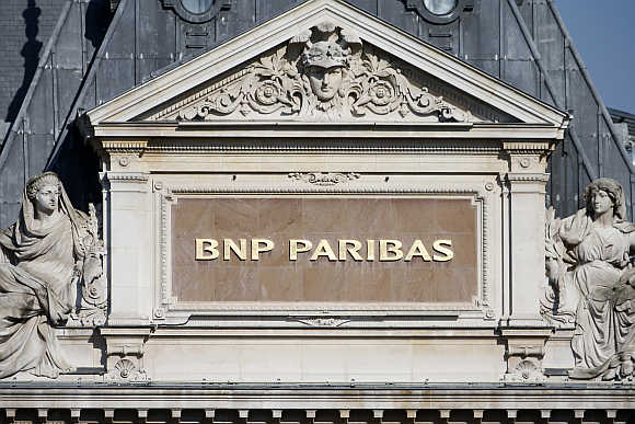 BNP Paribas plaque is seen on the roof of one of their main banks in central Paris.