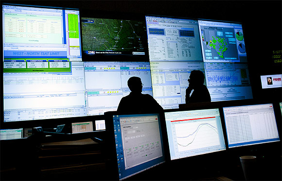 Engineers monitor a state power grid in the US.