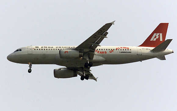 An Indian Airlines Airbus A320 flies over New Delhi.