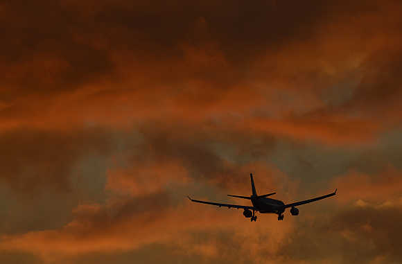 A plane prepares to land at Heathrow Airport in west London.