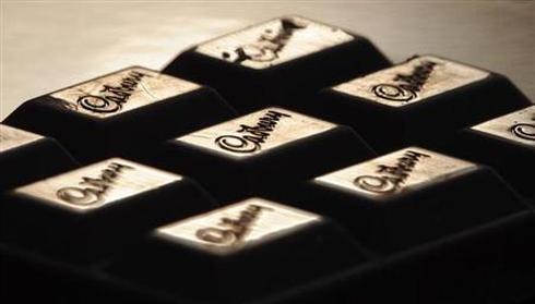 The Cadburys logo is seen on a bar of chocolate.
