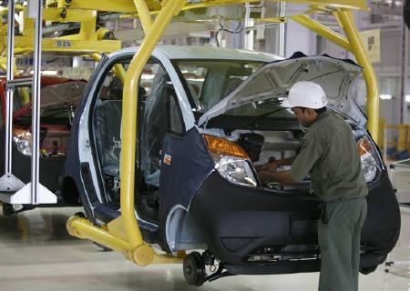 An employee works inside a plant for the Tata Nano car at Sanand.