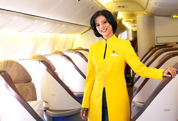 An air hostess posing in a Jet Airways aircraft.