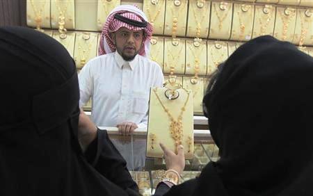 Women look at jewellery at the gold market in Riyadh.