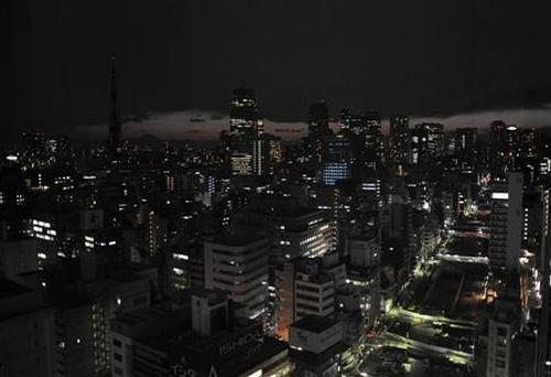 Lights are turned off to save energy before rolling blackouts in Tokyo.