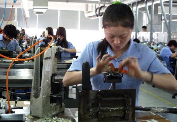 Workers at a Chinese factory. China is in the throes of a slowdown.