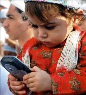 A child plays with a mobile