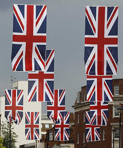 Union Jack flags hang over Elizabeth Street in London.