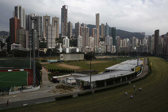 Luxurious residential blocks are seen behind Happy Valley horse racing track in Hong Kong.